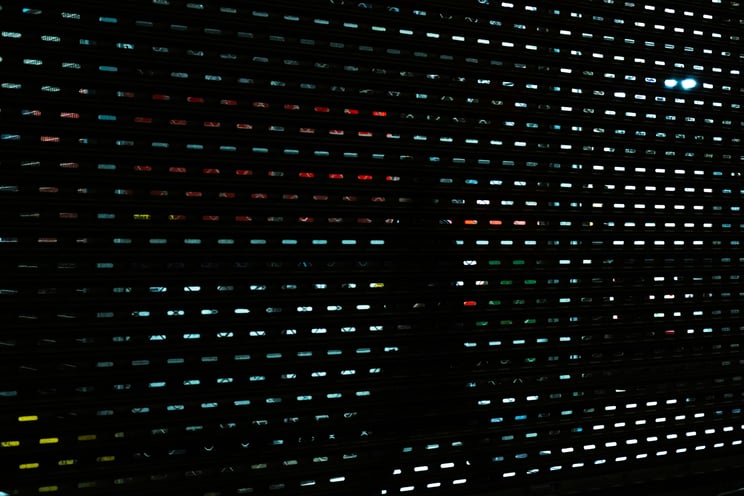 Abstract grid of small glowing lights on a dark surface